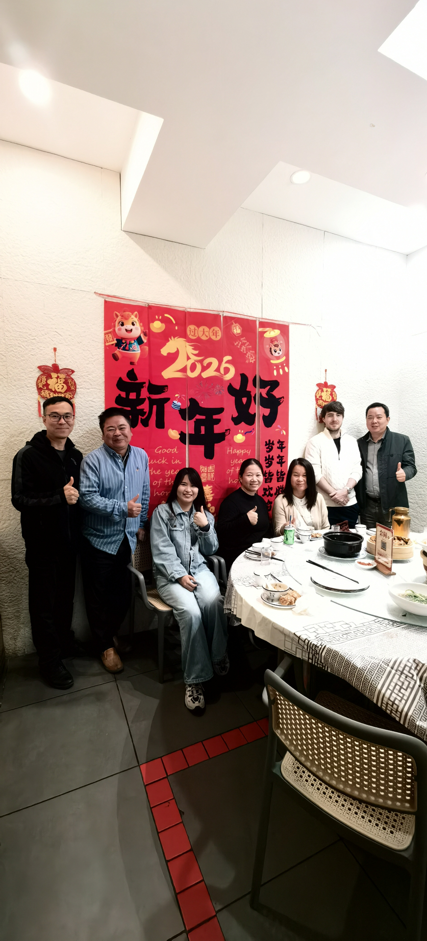 The FactoryChecker team gathered around a table in Zhuhai