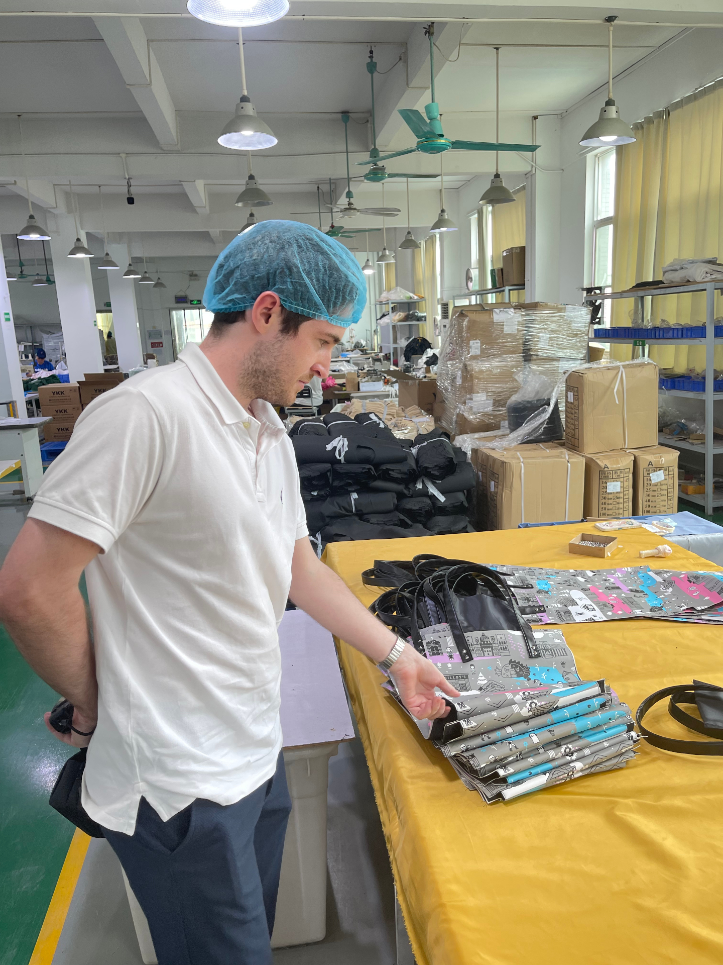 A FactoryChecker analyst on the production floor of a Chinese factory